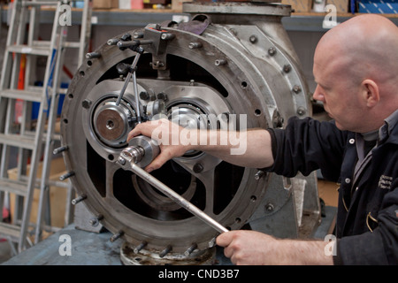 Engineer repairing heavy mechanical equipment Stock Photo