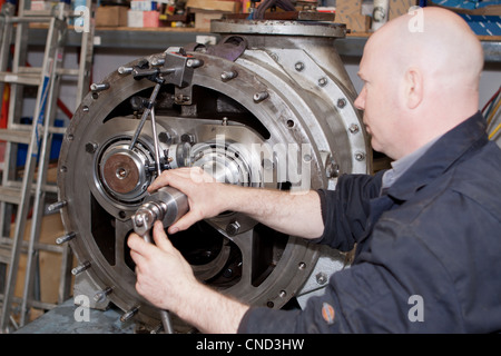 Engineer repairing heavy mechanical equipment Stock Photo