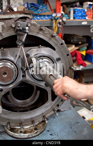 Engineer repairing heavy mechanical equipment Stock Photo