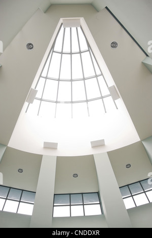 A modern architectural interior with a triangular shaped skylight. Stock Photo