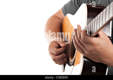 Closeup of a mans hands strumming and electric acoustic guitar isolated over a white background. Stock Photo