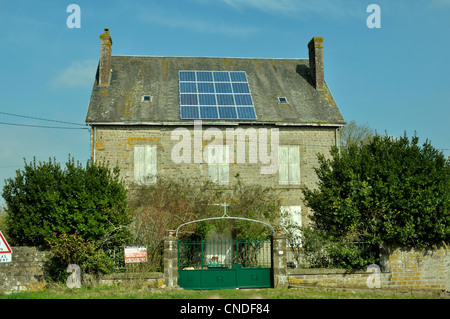 Photovoltaic solar panels on the roof of an old rectory, in Mayenne department (France). Stock Photo