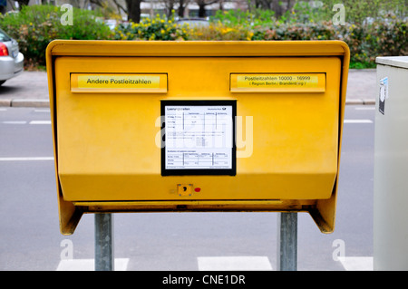 Berlin, Germany. Standard public Mailbox / Postbox in the street Stock Photo