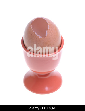 Signle egg with cracked shell in eggcup Stock Photo