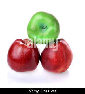 Pyramid with one green apples and two red apples on white background Stock Photo