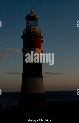 Smeaton's Tower, a red and white striped lighthouse at dusk on Plymouth Hoe Stock Photo