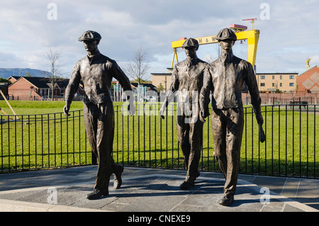 Yardmen statues to commemorate the men who worked in the Harland and Wolff shipyard. Artist: Ross Wilson. Stock Photo