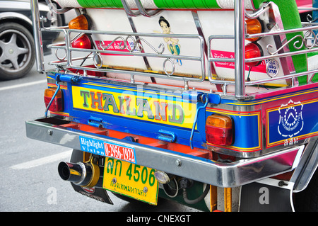 Detail on Tuk-tuk taxi diving in traffic, Samphanthawong District, Bangkok, Thailand Stock Photo