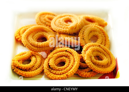 Popular south indian deep fried snack called murukku or muruku. Stock Photo