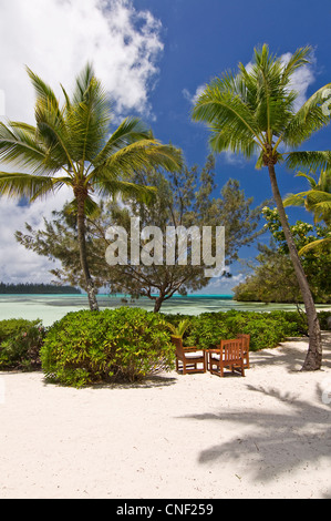 Table and chairs on the beach of Le méridien resort - Ile des Pins, New Caledonia Stock Photo