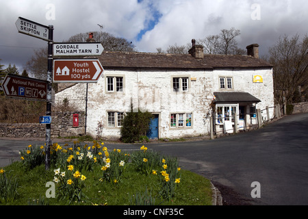 Subsided, subsidence in property & Road Sign for Mallam Tarn, Gordale Youth Hostel, Settle & Skipton in Malhamdale, North Yorkshire Dales, UK Stock Photo