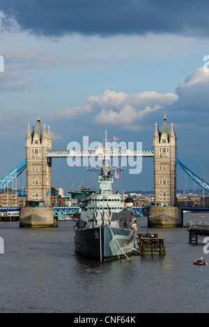 Tower Bridge with HMS Belfast on river Thames, London, England. Stock Photo