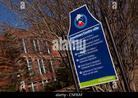 A sign pointing to various tourist attraction is pictured in downtown Fredericton, New Brunswick Stock Photo