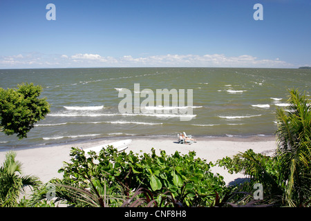 Nicaragua Isla Ometepe on Lake Nicaragua view from terrace at Hotel Villa Paraiso with green garden and quiet white sand beach Stock Photo