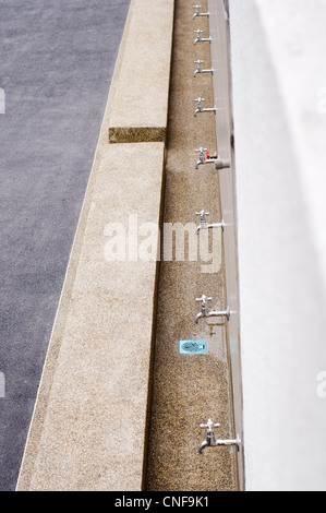 wudu (or ablution) area, where Muslims wash their hands, forearm, face and feet before they pray. Stock Photo