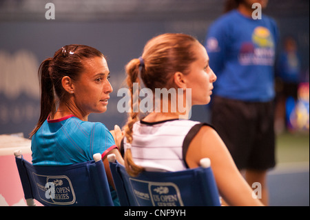 Doubles partners, Flavia Pennetta and Gisela Dulko, resting courtside at La Costa Resort in Carlsbad, California. Stock Photo