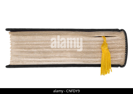 Top end view of page edges of closed hardcover book with roughly ...