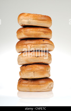 Stack of cinnamon raisin bagels on white background, cutout. Stock Photo