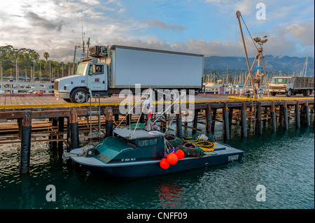 Local fishing boat loaded with a fresh catch of sea urchins reaching the Santa Barbara Harbor, California. Stock Photo