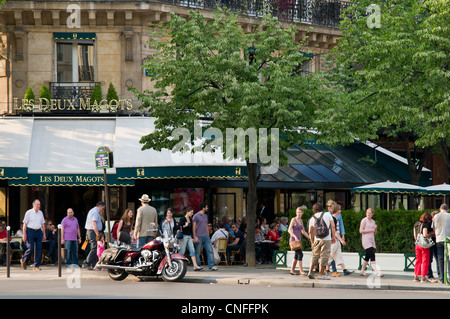 People eating at street cafe Les Deux Magots on Boulevard Saint Germain in Paris, France Stock Photo