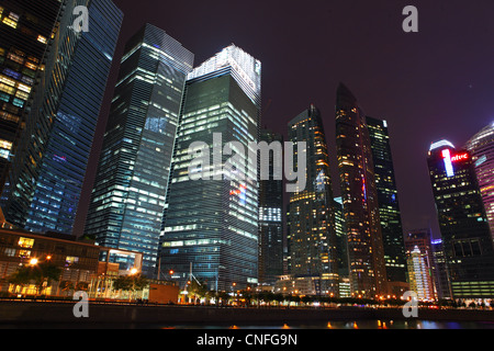 Singapore central business district buildings at dusk in Marina Bay. Stock Photo