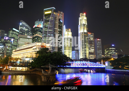 Singapore central business district buildings at dusk in Marina Bay. Stock Photo