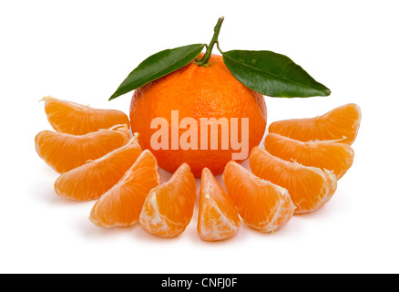 ripe tangerines with leaves and segments on a white background Stock Photo