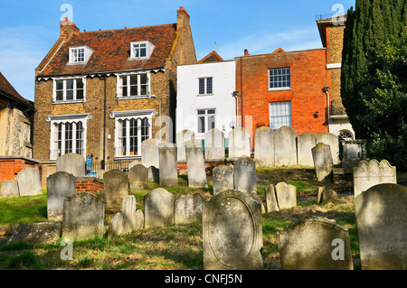 Property overlooking a graveyard, Guildford, Surrey, UK Stock Photo