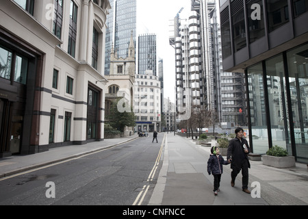 Street view of city of London, with Lloyds building in background. Stock Photo