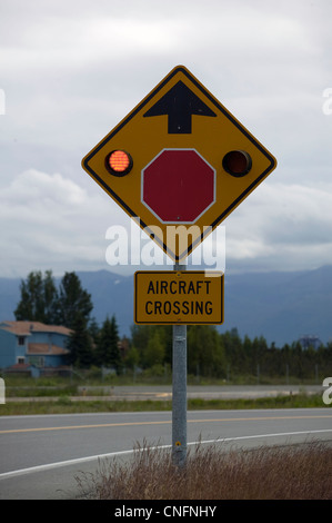 aircraft crossing sign flashing lights Lake Hood airport Anchorage Alaska Stock Photo