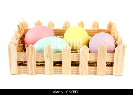 Basket of easter eggs on a white background Stock Photo