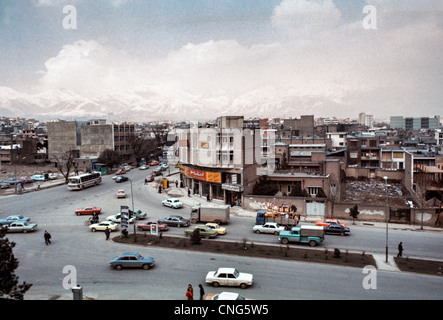 IRAN, TEHRAN: Busy intersection in downtown Tehran, largest city and capital of Iran, with the Alborz Mountains. Archival photo Stock Photo