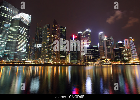 Singapore central business district buildings at dusk in Marina Bay. Stock Photo