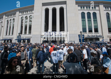 Thousands of fans arrive for the home opener at Yankee Stadium in the New York borough of The Bronx Stock Photo