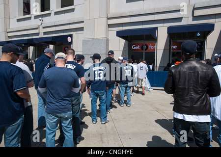 Thousands of fans arrive for the home opener at Yankee Stadium in the New York borough of The Bronx Stock Photo