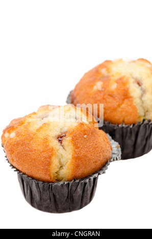 Two raspberry and white chocolate chip muffins on white - shallow depth of field Stock Photo