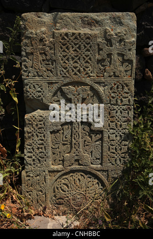 Medieval khachkar in front of the Surb Arakelots Church in Sevanavank Monastery on Sevan Lake in Armenia.