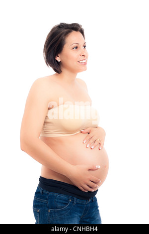 Happy beautiful pregnant woman holding her belly, isolated on white background. Stock Photo
