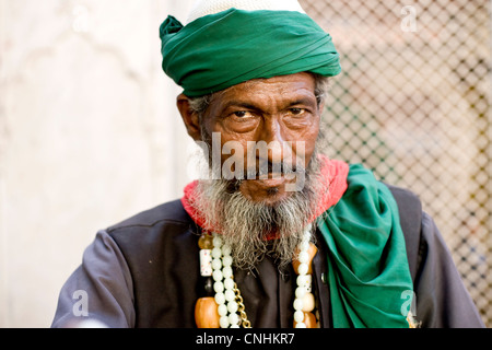 Muslim fakir at Nizamuddin shrine Delhi ,India Stock Photo