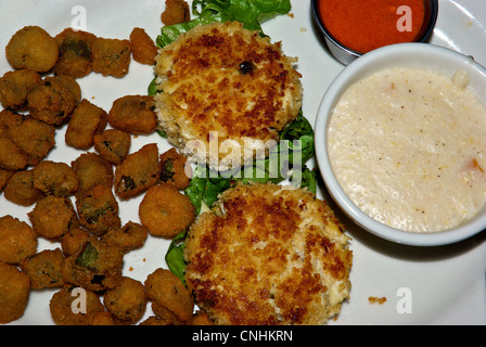 Deep fried battered okra Panko crusted crab cakes bowl cheese grits remoulade dipping sauce Stock Photo