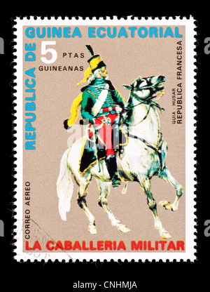 Postage stamp from Equatorial Guinea depicting a French Republic calvary office on a horse. Stock Photo