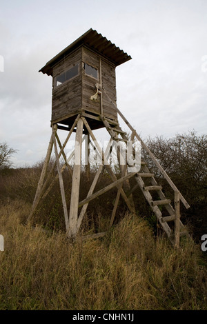 A hunting tower in a field Stock Photo