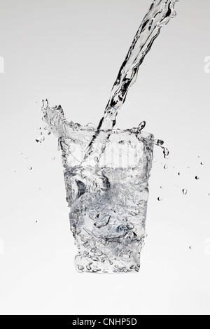 Water being poured in the form of a glass Stock Photo