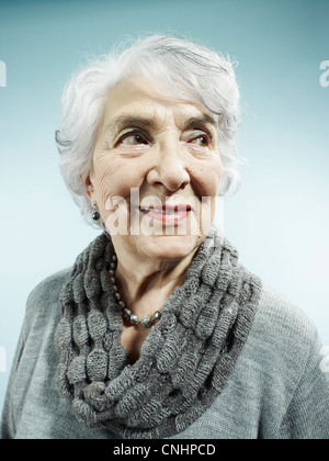 An elegant senior woman smiling and looking away Stock Photo