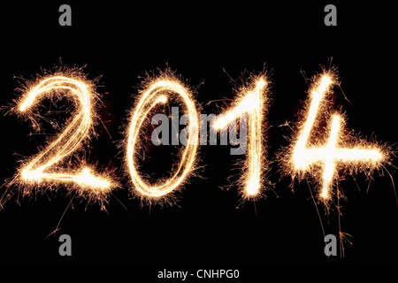 A light painting of the year 2014 written against a black background Stock Photo