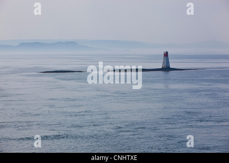 A white lighthouse from the Mull ferry near Oban, Scotland Stock Photo