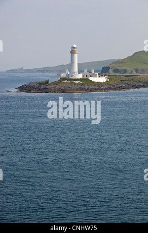 A white lighthouse from the Mull ferry near Oban, Scotland Stock Photo