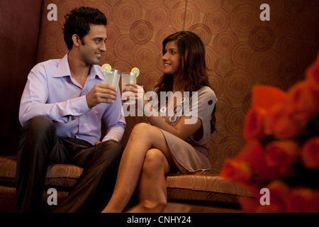 Couple having drinks in a restaurant Stock Photo