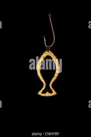 golden fish charm and fishing hook Stock Photo