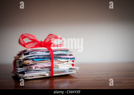 Stack of letters tied together with ribbon Stock Photo